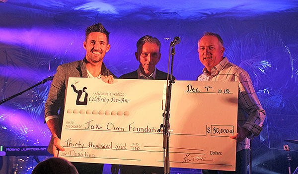 Jake and Steve receive a $30,000 check