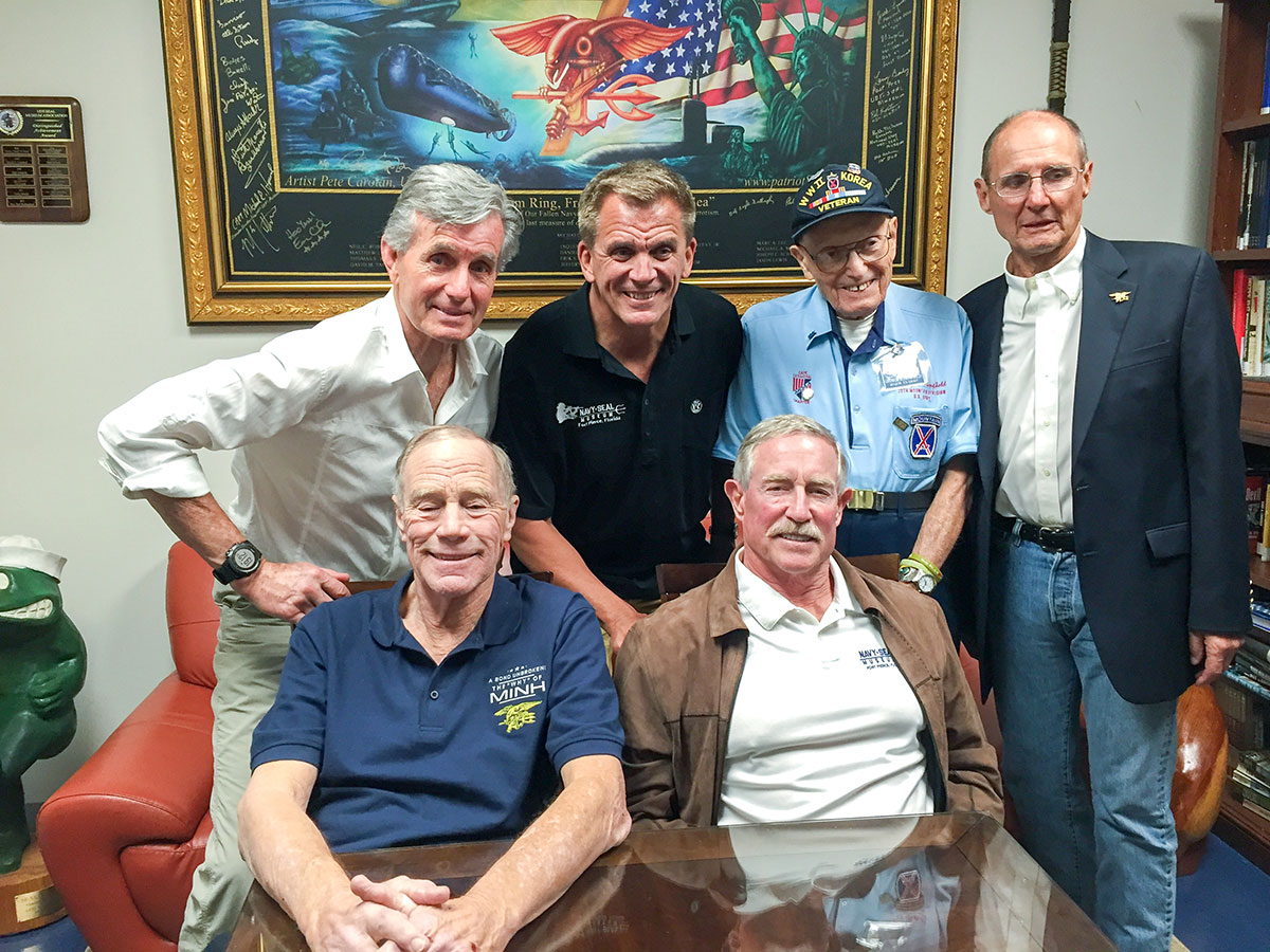 Yeaw and former SEAL Capt. Rick Woolard; and standing, from left, Donovan, SEAL museum executive director Rick Kaiser, a World War II veteran and Robert “Pete” Peterson, Yeaw’s 7th Platoon commander