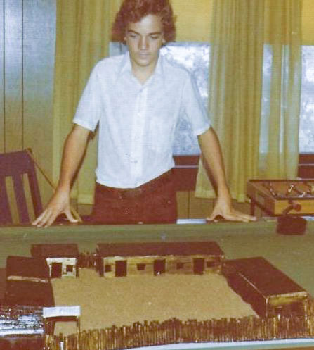 A young Gregory Enns displays a replica of Fort Pierce