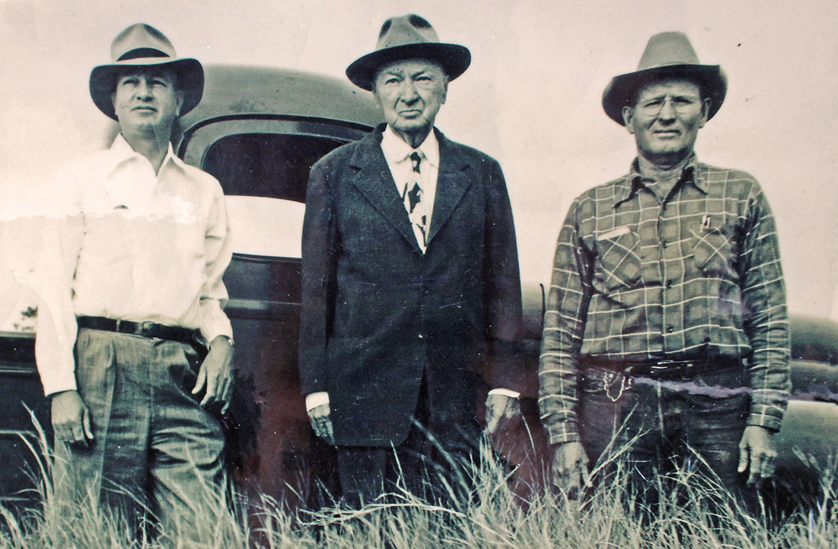 Frank Raulerson is seen on Cow Creek Ranch with his bookkeeper, O.G. Nanney and foreman John Norman